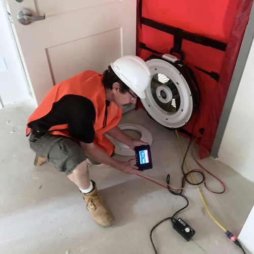 HERS Rater performing a blower door test.